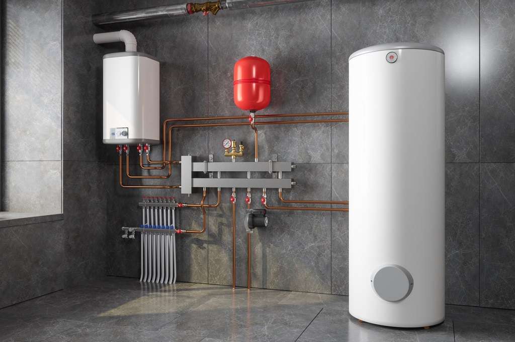 A modern indoor heating system setup featuring a white wall-mounted tankless water heater on the left side and tank water heater on the right. The system is installed against a gray tiled wall and floor.